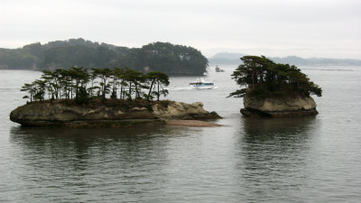 Pair of islands with passing boat