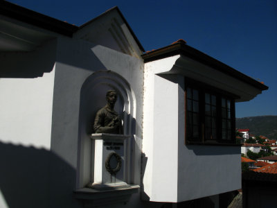 Memorial bust on a 19th-century house