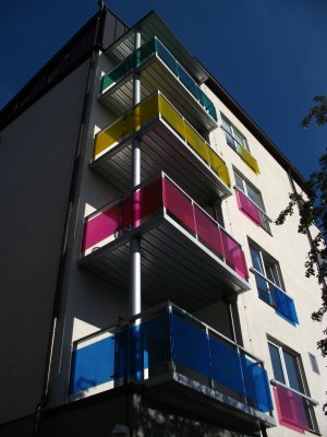 Colorful balconies on a modern housing block