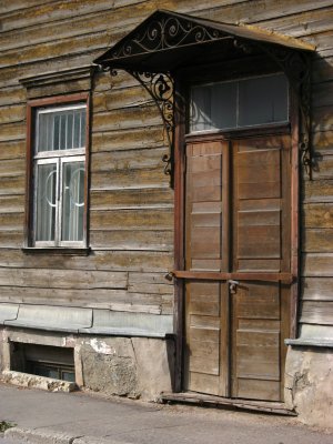 Door and window of a faded wooden house