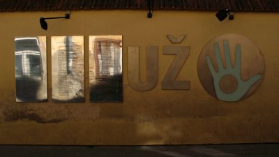 Wall with Užupis constitution and emblem