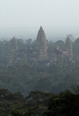 angkor from sunset on phnom bakheng, a super crowded spot, with death defying stairs