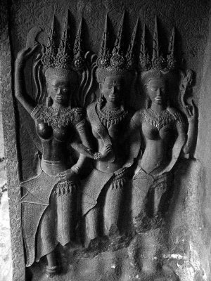 after pshop
the devata of the bas-reliefs who stand, richly adorned and motionless, holding flowers - and the nagas, the stylisation of a multi-headed cobra, descendants of Nagaraja, the mythical ancestor of the Khmer kings, and genies of the water.
