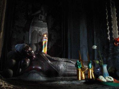 this is what is inside the central tower of angkor wat!
Death and the entrance to Nirvana are portrayed with the representation of the Buddha lying on his right side, with one arm along his body and the other folded under his head., sleeping on a naga/serpent, the heads of serpant visible to right of buddha's head here