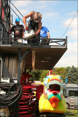 Setting up the kiddy Dragon ride.