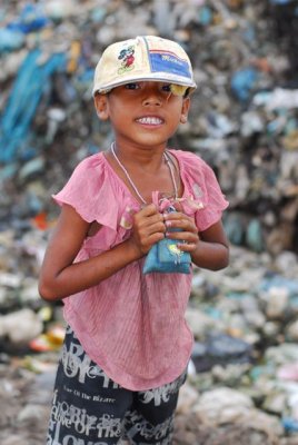 Small girl at the landfill.