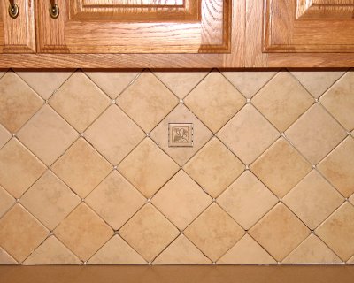 Deco tile below cabinet