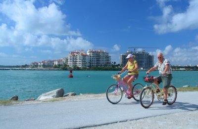 A couple bike riding at Miami beach