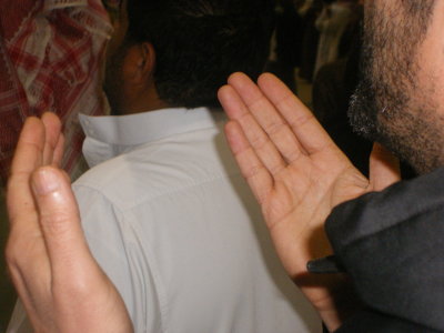 Dr Kamel praying after the first joumourat,Mina