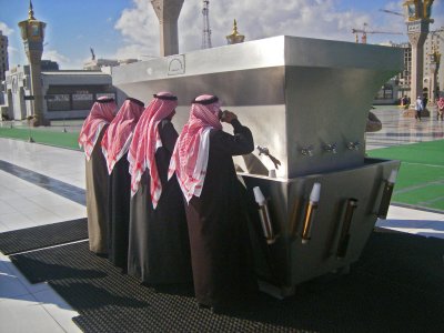 Local men drinking zamzam water  in the haram