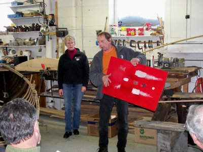 The red panel being held by Norm, shows different forms of fiberglas damage.