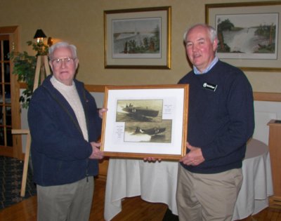 Rich DeGlopper (r), NFACB President, presents a photo collage of Miss Mary to Bill Morgan in appreciation for his talk.