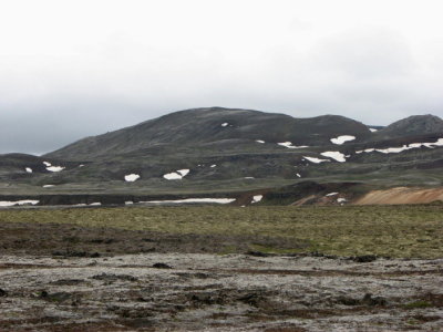 Old lava ridge with snow