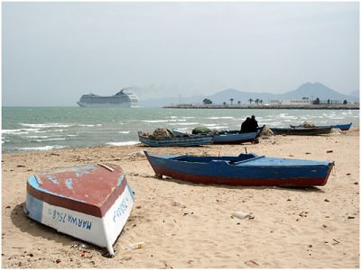 Fishermen boats and cruise ship