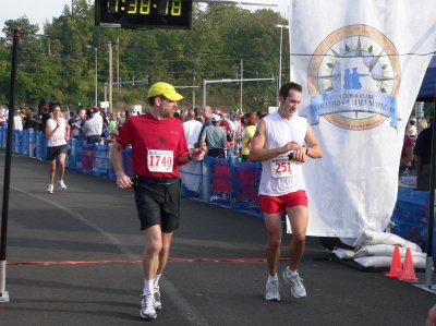 Greg and Tim crossing the finish line