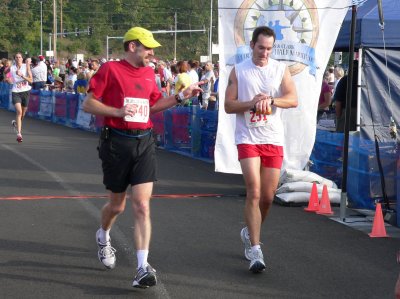 Greg and Tim crossing the finish line
