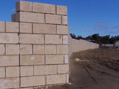 Retaining wall at the rear of block.