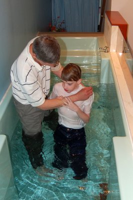Baptised in the name of the Father, the Son and the Holy Spirit.