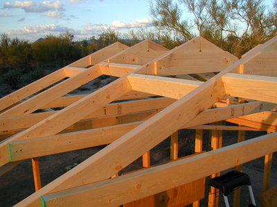 Truss detail. basically an 'A' frame with a piece of 1x6 at the top and a 2x4 cross-member. These attached easily to the carriage uprights and are 2 ft. on center.
The struts were then added between the trusses.