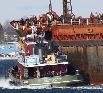 Med Integrity, bow detail, with tug working