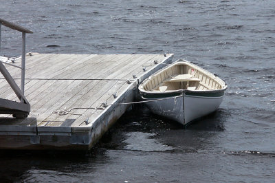 Dinghy at dock, in transit