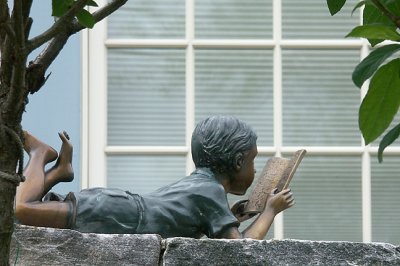 Reading boy sculpture, in transit