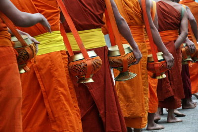 Early in the morning, the monks walk barefoot to get their food from the citizen - Luang Prabang - Laos