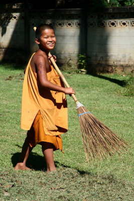 One of the task of a monk is cleaning the monastery - Thailand
