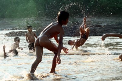 Childrens playing in the river. Laos