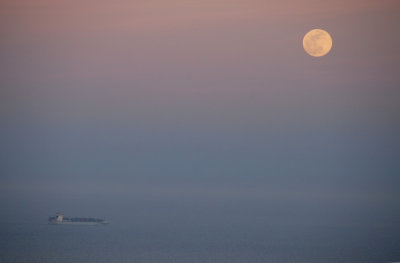 Full moon and container ship