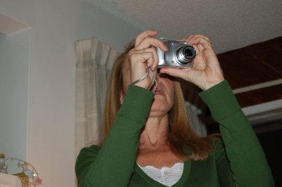 Using The Claw Method to hold her camera.