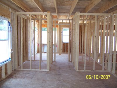 Looking into the master bath from the Master Bedroom.  Walk-in closets are on each side of the hallway into the master bath.