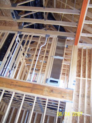 Other side of family room, showing the wiring coming down from the ceiling.