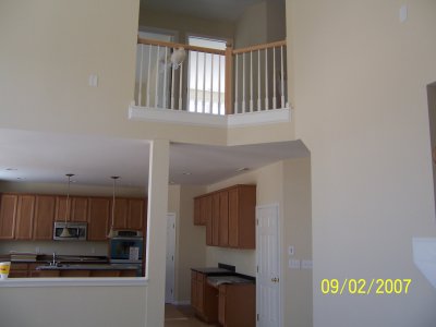 View into the kitchen and part of the upstairs from the family room.