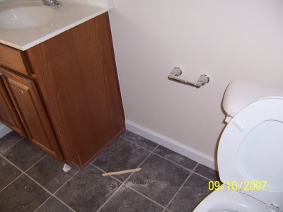 A view showing how much open space there was on the other side of the toilet.  Obviously a screw up by the plumber!