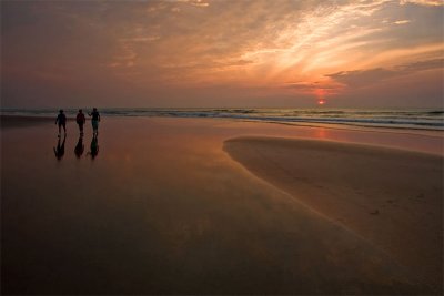 Beachcombers at Dawn