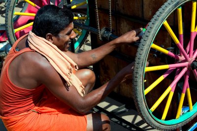 Repairing his Tricycle