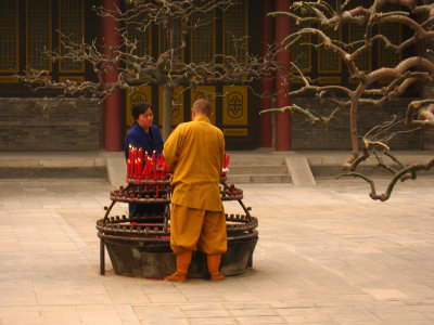 Lighting candles and incense at the Big Wild Goose Pagoda, Xian