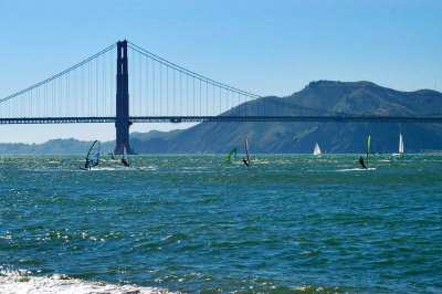 windsurfers on the bay