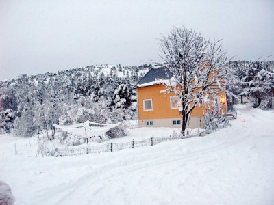 Sweet house with snowed-covered clothes line