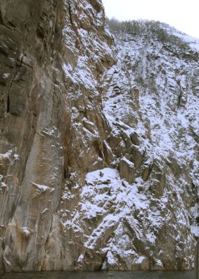 HUGE granite cliff along the side of the fjord