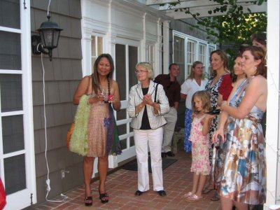 The guests enjoying the cake cutting