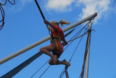A Young Lady Enjoying The Bungy Trampoline