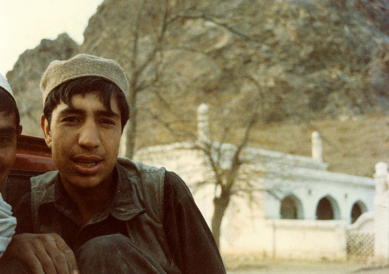 Boy in truck and mosque