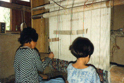 Two girls at a loom