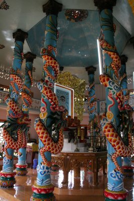 Dragon pillars inside Cao Dai temple