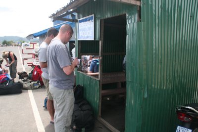 At the Cambodian border passports are checked in a metal hut