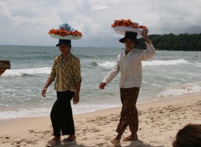 lots of saleswomen on the beach