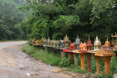 lots of spirit houses on road to Phnom Penh