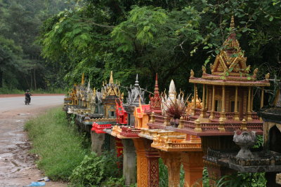 lots of spirit houses on road to Phnom Penh